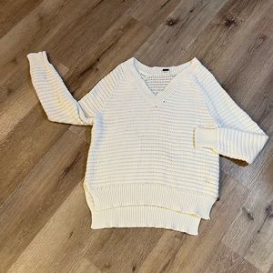 Woman’s oversized cable sweater.
